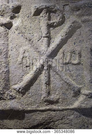 Caceres, Spain - Dec 12th, 2019: The Chi Rho, One Of The Earliest Forms Of Christogram. Caceres Muse