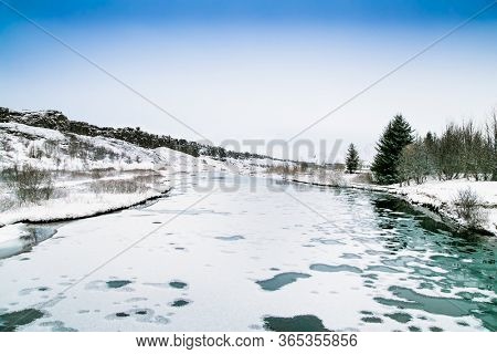 Beautiful view on Silfra rift during winter, the place where Eurasian and the American tectonic plate are divided in Thingvellir National Park, Iceland. 