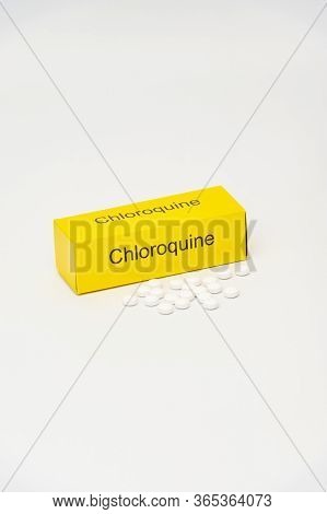 Chloroquine Packaging With Scattered Tablets. Isolated On White Background. Chloroquine Is A Drug Us