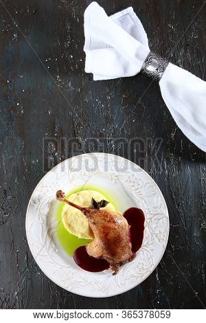 Duck Leg With Cherry Sauce And Mashed Potatoes.served With Green Butter. Napkin With A Vintage Ring 
