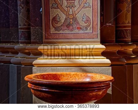 Djakovo, Croatia - October 5, 2017: Old Marble Baptismal Font At The Entrance To The Church Of The C