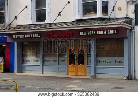 Llandudno, Uk : May 6, 2019: The Llandudno Branch Of Harvey's New York Bar And Grill Is Located On M