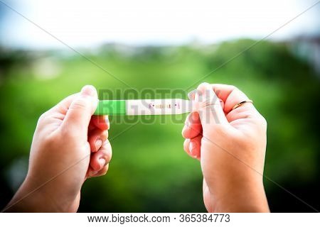 Positive Pregnancy Test On Strip. Baby Coming Soon Concept.