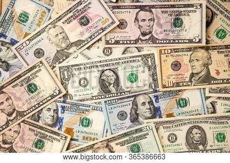 Money American Hundred Dollar Bills Pile Of Various Currencies Isolated On White Background. Closeup