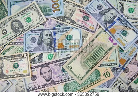Money American Hundred Dollar Bills Pile Of Various Currencies Isolated On White Background. Closeup