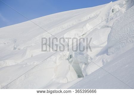 Big Snow Pack With Glacier Crevasse On Mont-blanc Du Tacul In The French Alps, Chamonix-mont-blanc,