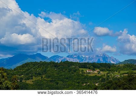 Beautiful View Of The Vicentine Mountains Behind The Green Hills And Immense White Clouds In Vicenza