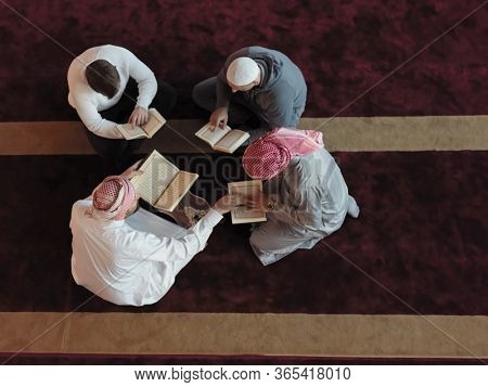 top view of muslim people in mosque reading quran together concept of islamic education and school of holly book kuran