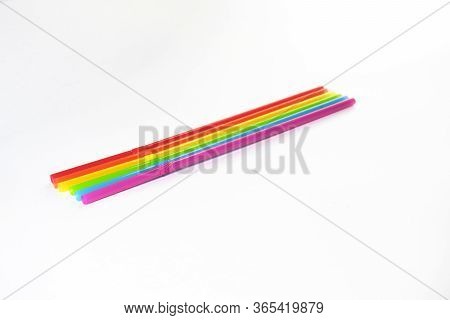 Seven Straws Of Bright Rainbow Colors Isolated On A White Background. They Lie In A Row. Greeting Ca