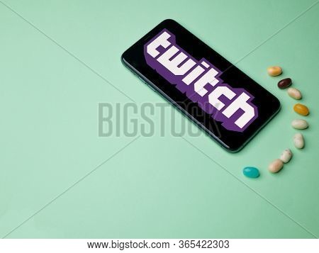 Usa - May, 2020 Twitch Iphone Application Screen With Candy On Colored Paper Background. Twitch