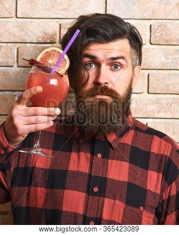 Hipster Enjoy Strong Drink Or Cocktail. Man Holds Alcohol