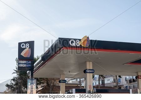Sicily - February 11, 2020: The Roof With A Logo Of Q8 Gas Station On A Banner With Prices Of Fuel W