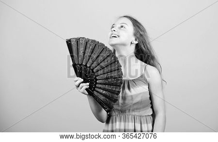 Cooling And Ventilation. Summer Heat. Fresh Air. Kid Girl Fanning Herself With Fan. Conditioning Sys