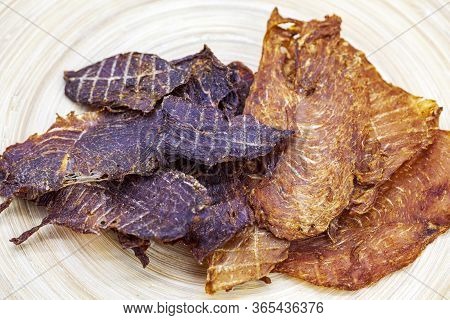 Dry Jerky Jerky For Beer. Beef And Jerky Chicken On A Wooden Background