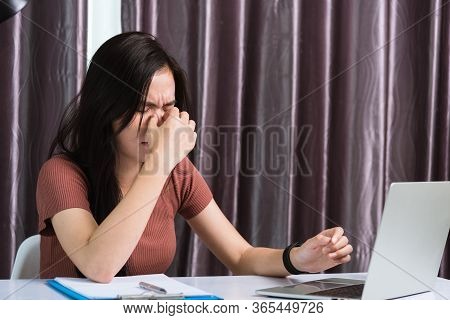 Work From Home, Fatigued Or Strain Asian Business Young Beautiful Woman Sits On Desk Workspace Feeli