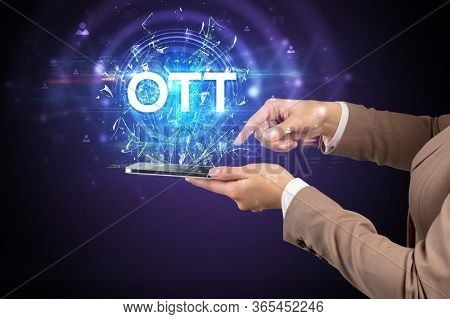 Close-up of a touchscreen with OTT abbreviation, modern technology concept