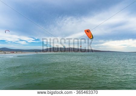 Langebaan, South Africa - February 3, 2019: People Kite Surfing In Langebaan Seaside Town In South A