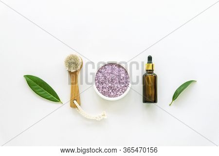 Cosmetic Face Brush, Lavender Scrub And Skin Serum In A Bottle On White Background. Natural Cosmetic