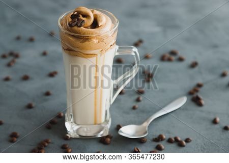 A Glass With A Trendy Dalgon Trendy Coffee Drink. Drink In Vegetable Or Plain Milk With Thick And Sw