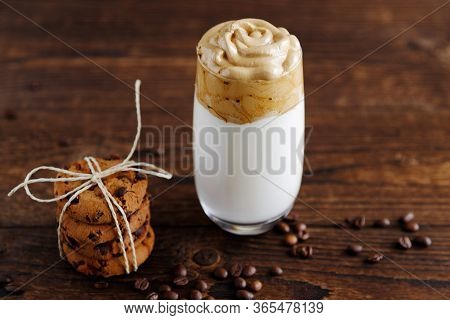 Fashionable Drink With Foam Of Instant Dalgon Coffee On A Rustic Wooden Table Next To Chocolate Chip