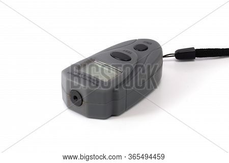 Measuring The Thickness Gauge Of The Paint Coating Isolated Gray On White Background