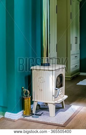 Cape Town, South Africa - February 6, 2020: Small Compact Designer Lounge Wood Burning Fireplace