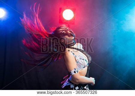 Girl Dancing Belly Dance, Fusion Or Tribal. A Woman In A Beautiful Costume Demonstrates Charming And