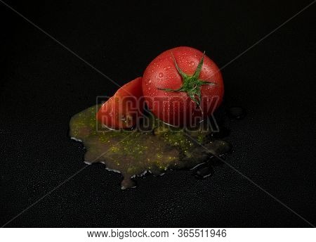Fresh Wet Tomatoes On A Black Background. Sliced Tomatoes With Pulp