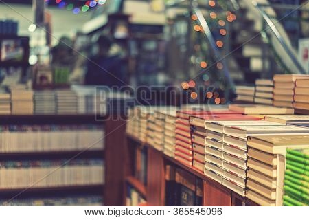 Image Of Abstract Blur People At Book Store In Shopping Mall For Background Usage. Toned