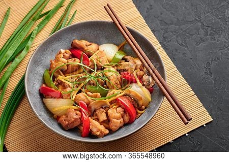 Thai Ginger Chicken Or Gai Pad King In Gray Bowl At Black Slate Backdrop. Gai Pad King Is Thailand C