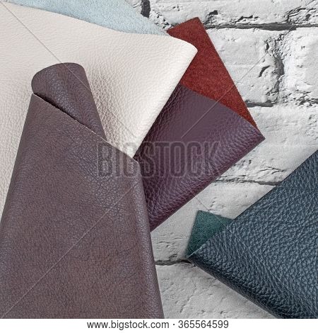 Different Colors Natural Leather Textures Samples On Grey Brick 
Background