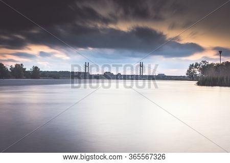 Cable-stayed Bridge Over A Dutch River Near The Town Of Kampen
Overijssel With A Cloudy Sunset