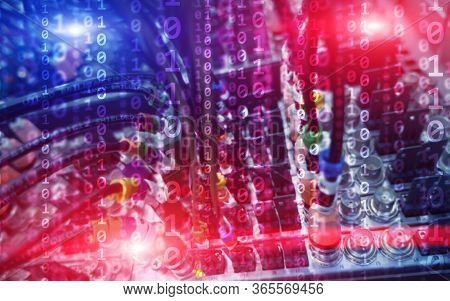 Multi-colored Binary Code Matrix Digital Internet Technology Concept On Server Room Background.