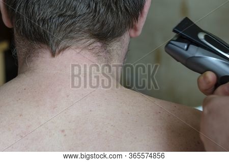 View From The Back Of A Man With Uncropped Hair. Adult Man With Short Hair On His Back. Adult Man Wi