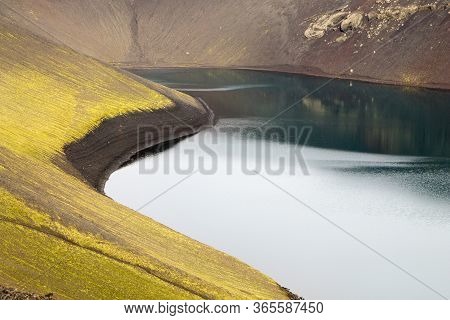 Volcanic Crater With Water Near Landmannalaugar Area, Iceland. Colored Mountains