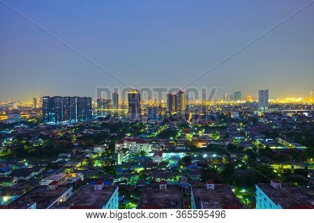 Cityscape From High Rise Building At Night With Skyline And Clouds. Skyscraper In Metropolis Town Wi