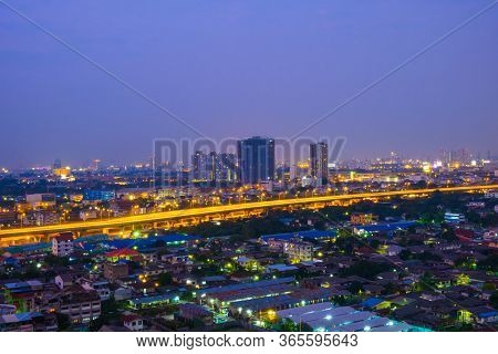 Cityscape From High Rise Building At Night With Skyline And Clouds. Skyscraper In Metropolis Town Wi