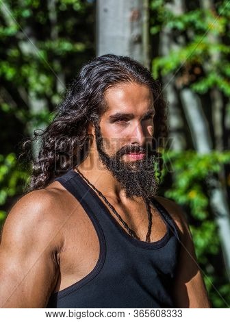 Handsome Bearded Man With Long Dark Hair. Sexy Bearded Model Man. Man Fashion And Style Concept. Por