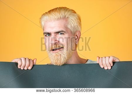 Man With Blank Sheet Paper. Advertising Banner. Blank, Empty Paper, Billboard With Copy Space For Te
