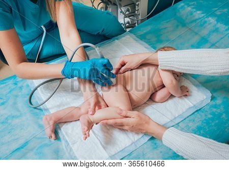 Doctor And Little Boy Patient. Ultrasound Equipment. Sonography. Hip Dysplasia