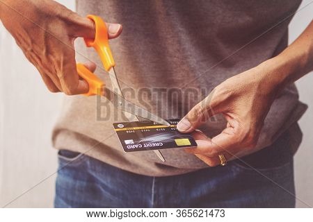 Man Cutting Credit Card With Scissors. Man