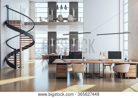 Contemporary Coworking Office Interior With Stairs And Computer On Desktop, Other Pieces Of Furnitur
