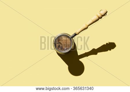Turkish Coffee Pot On Yellow Background. Space For Text