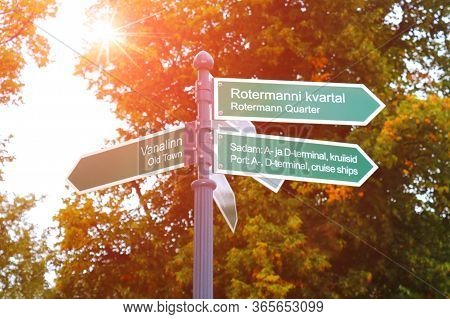 Signposts To The Old Town, Rotermann Quarter And Port In Tallinn, Estonia. Against The Background Of