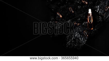 Acid Laying Among Natural Materials. Black Coal Cosmetics Top Horizontal View Scin Care And Anti-age