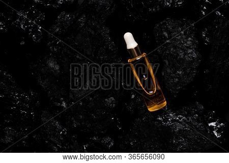 Acid Laying Among Natural Materials. Black Coal Cosmetics Top Horizontal View Scin Care And Anti-age