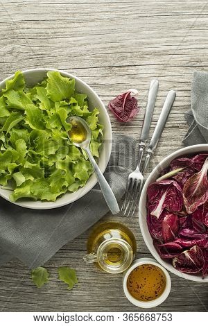 Healthy Red And Green Lettuce Salad Meals On Wooden Table Background. Eating Fresh Radicchio And You