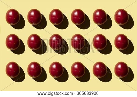 Red Tomato On A Yellow Background View From Above