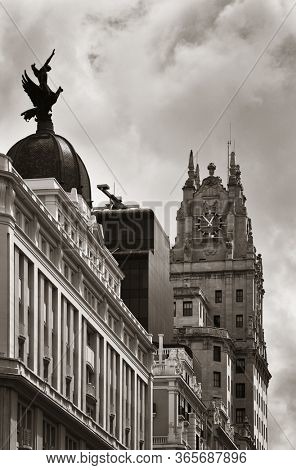 MADRID, SPAIN - MAY 13, 2018: Telefonica Building rise above historical buildings on Gran Via business district.