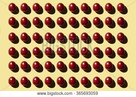A Lo Of Red Tomato On A Yellow Background View From Above